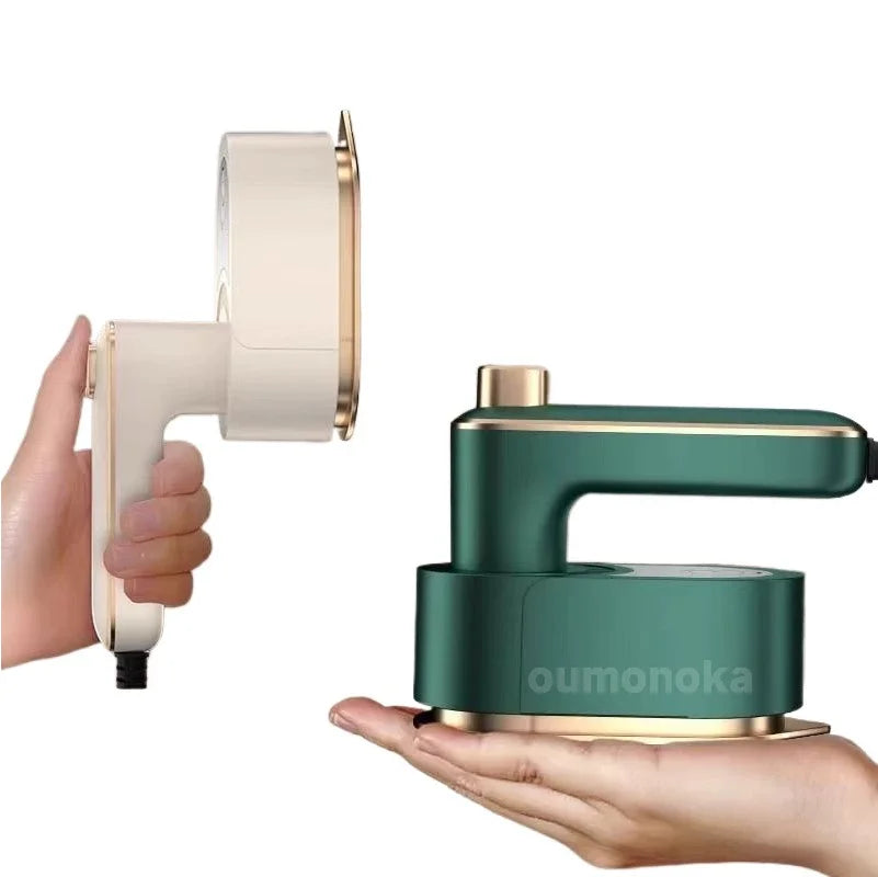 Compact handheld garment steamer in green and white for home cleaning and fresh air