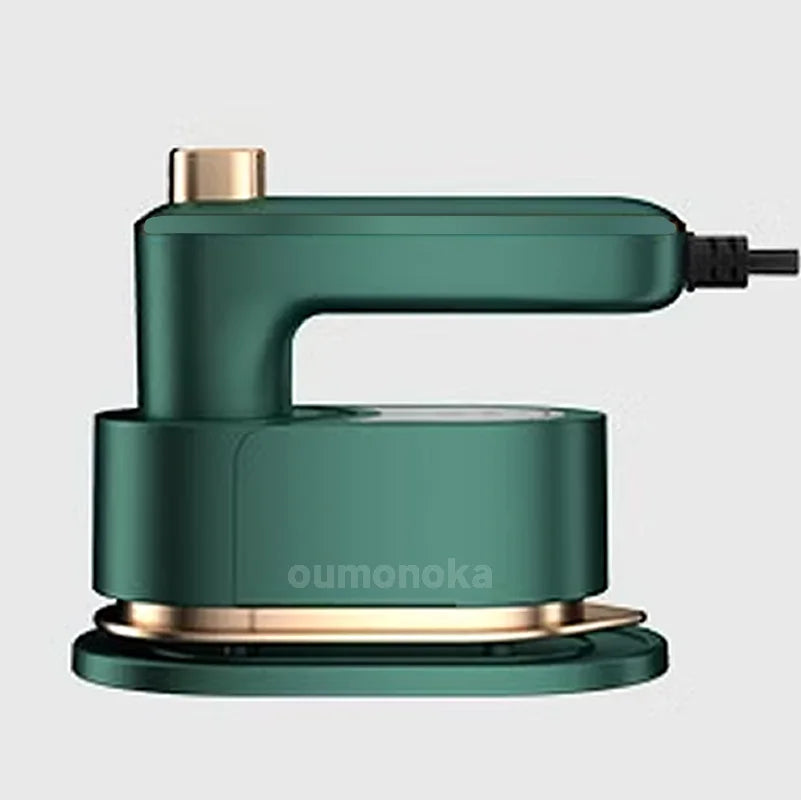Green handheld electric clothes steamer for home cleaning and freshening fabrics