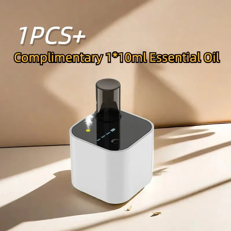 White essential oil diffuser with LED display on a beige surface, comes with 10ml oil bottle.