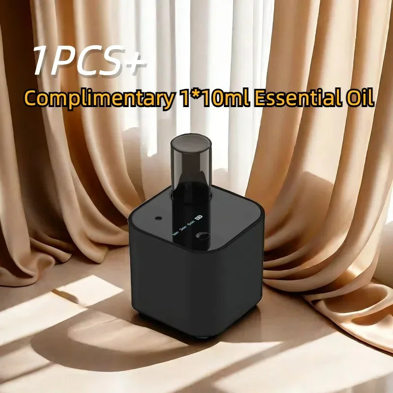 Black essential oil diffuser on floor with beige curtains, includes 10ml essential oil
