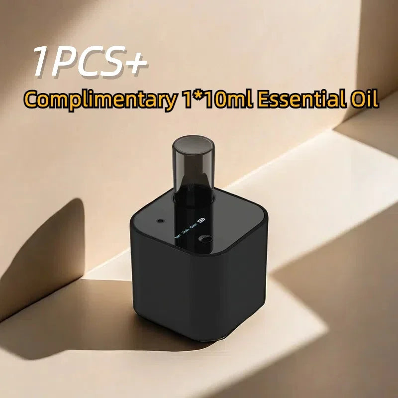 Black essential oil diffuser with digital display on minimal beige background, air freshener included